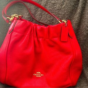Leather Coach Hobo bag. It’s a beautiful red color. Barely used like new.